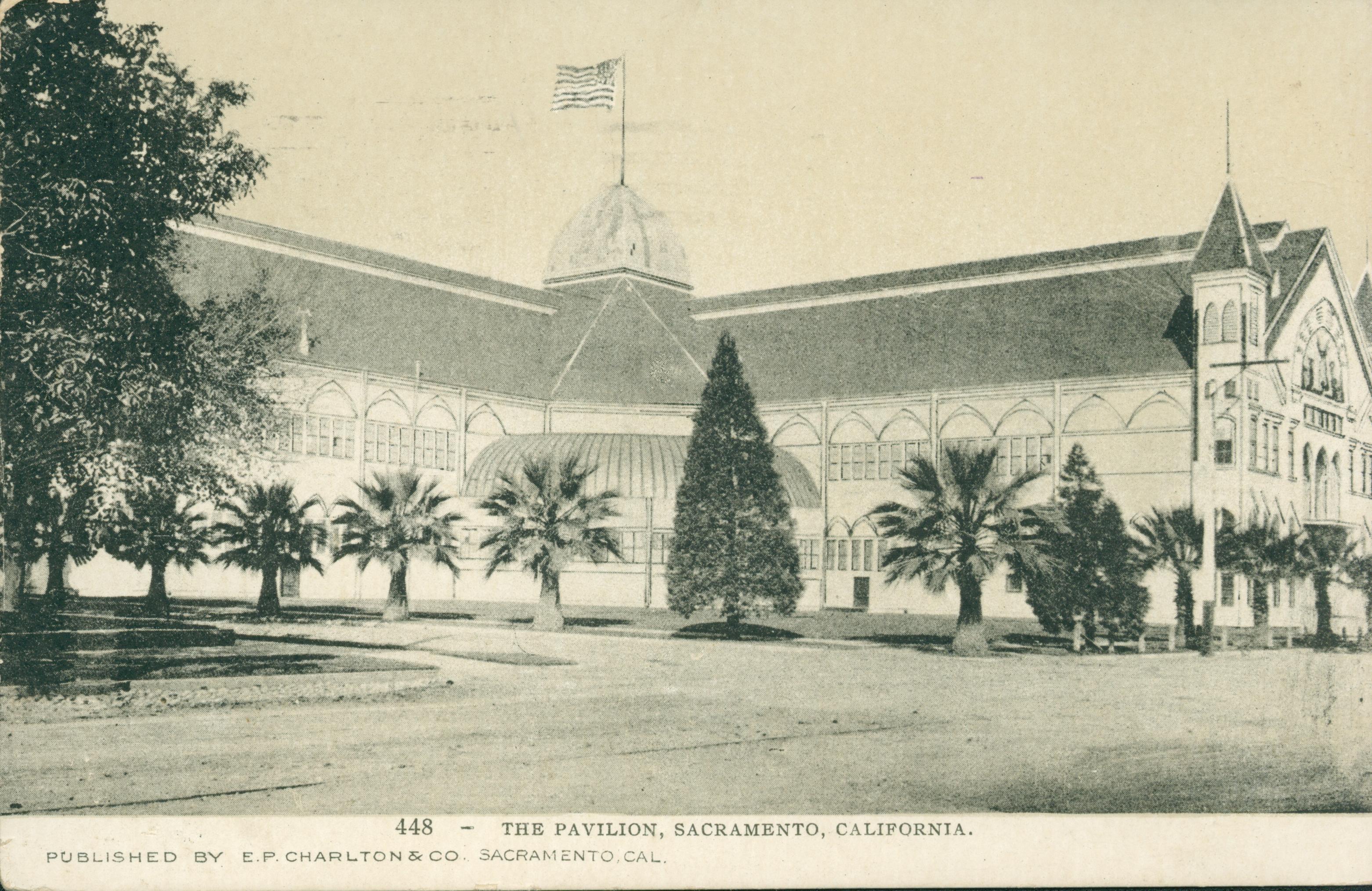 This postcard shows a corner view of the State Agricultural Pavilion